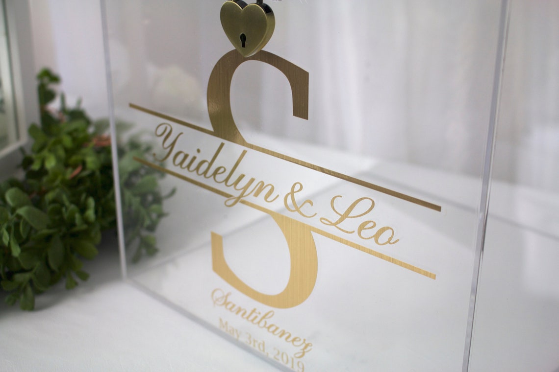 Acrylic card box with lock and key. Customizable designs and fonts made to keep celebratory cards, money or event donations safe and accessible. Place this beautiful card box anywhere your guests gather. thequinnandcompany www.thequinnandcompany.com