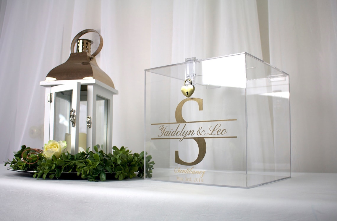 Acrylic card box with lock and key. Customizable designs and fonts made to keep celebratory cards, money or event donations safe and accessible. Place this beautiful card box anywhere your guests gather. thequinnandcompany www.thequinnandcompany.com