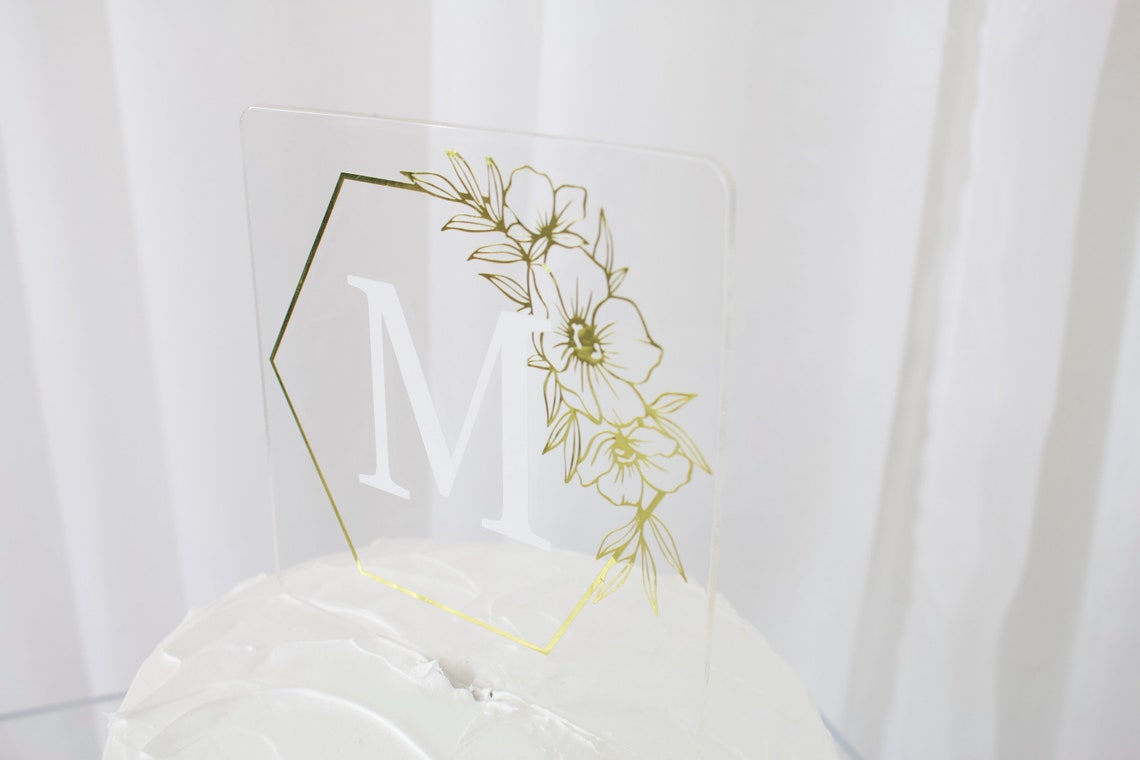 Wedding cake topper. Wooden or acrylic cake topper customized for any of your celebratory needs. Simplistic and elegant designs paired with multiple color schemes to top your celebratory baked goods. thequinnandcompany. www.thequinnandcompany.com