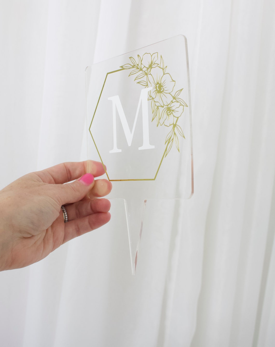 Wedding cake topper. Wooden or acrylic cake topper customized for any of your celebratory needs. Simplistic and elegant designs paired with multiple color schemes to top your celebratory baked goods. thequinnandcompany. www.thequinnandcompany.com