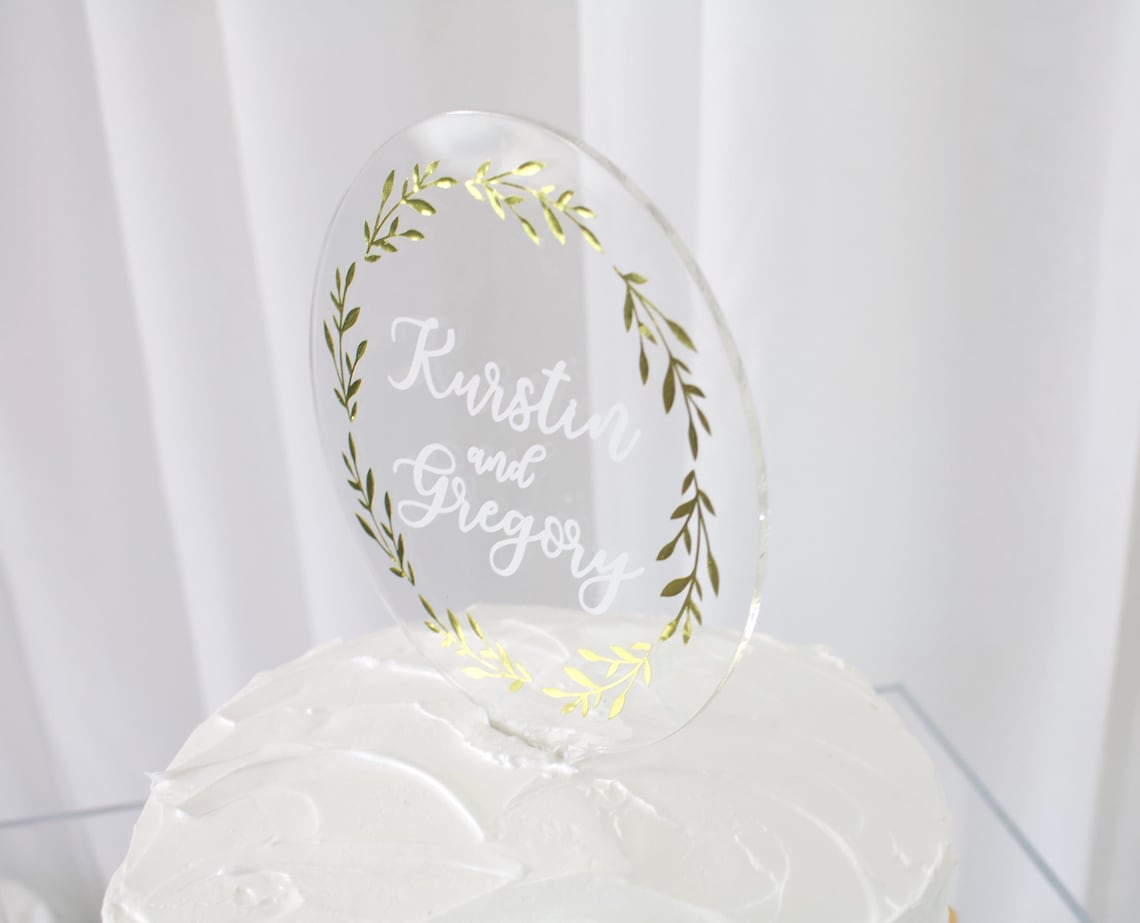 Wedding cake topper. Wooden or acrylic cake topper customized for any of your celebratory needs. Simplistic and elegant designs paired with multiple color schemes to top your celebratory baked goods. thequinnandcompany. www.thequinnandcompany.com