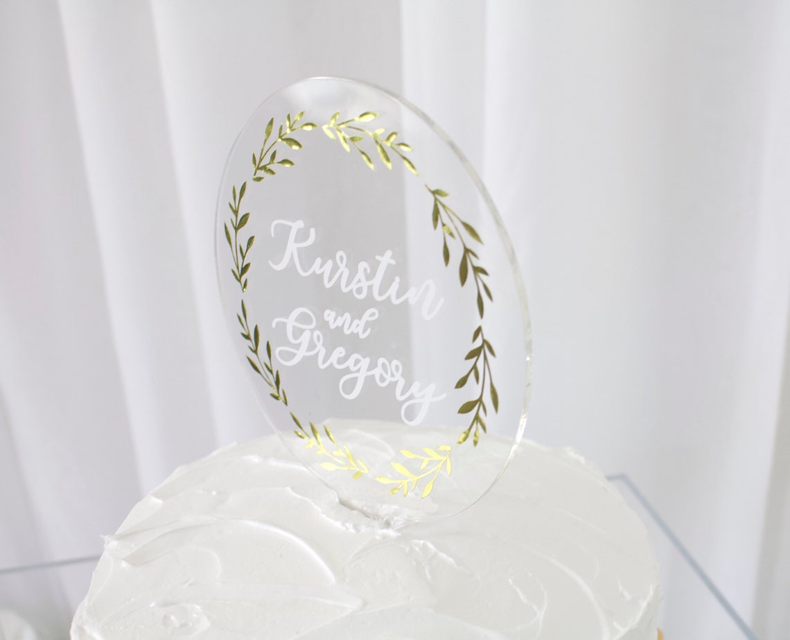 Wedding cake topper. Wooden or acrylic cake topper customized for any of your celebratory needs. Simplistic and elegant designs paired with multiple color schemes to top your celebratory baked goods. thequinnandcompany. www.thequinnandcompany.com