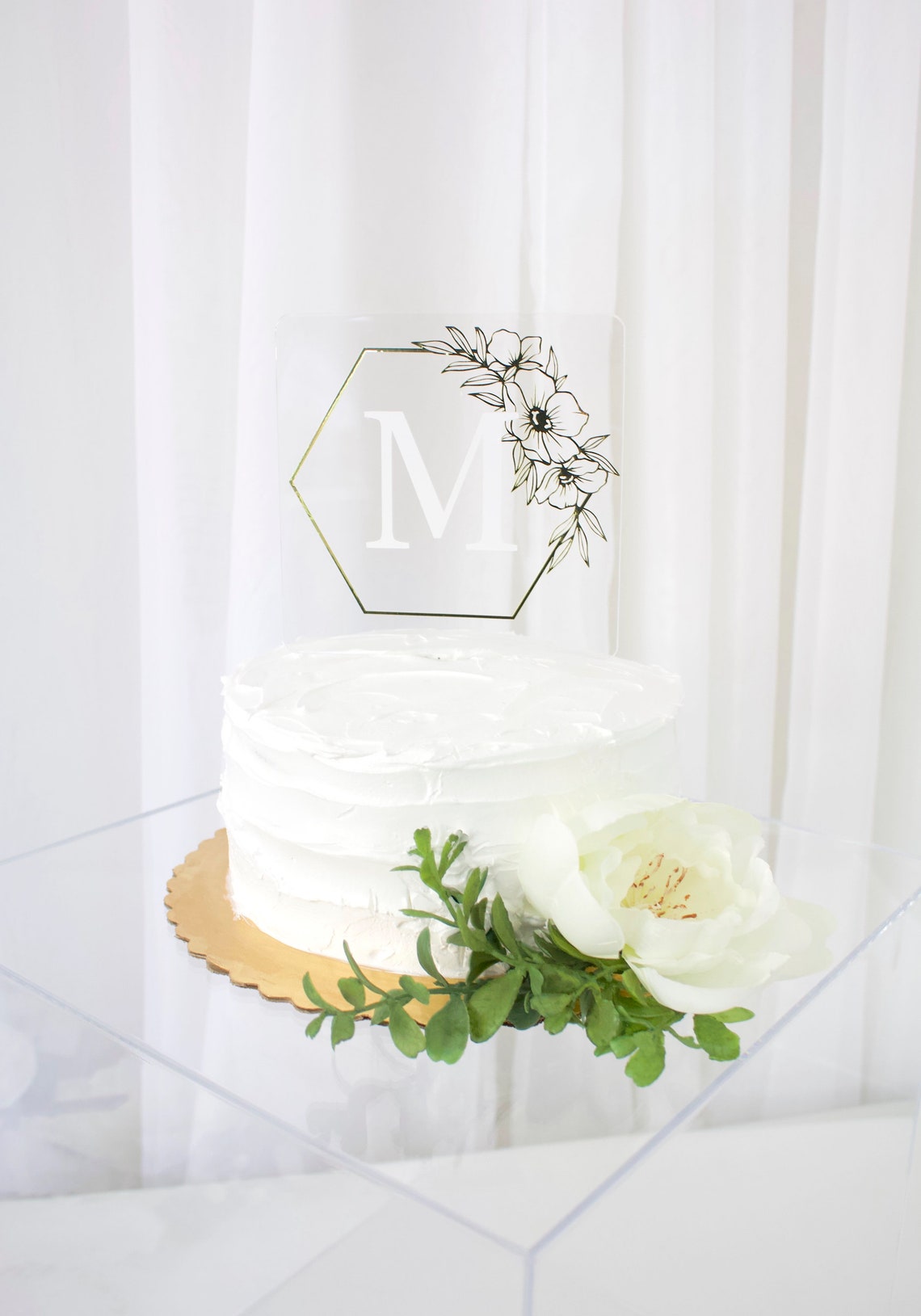 Wedding cake topper. Wooden or acrylic cake topper customized for any of your celebratory needs. Simplistic and elegant designs paired with multiple color schemes to top your celebratory baked goods. thequinnandcompany. www.thequinnandcompany.com