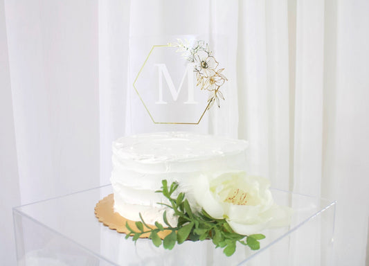 Wedding cake topper. Wooden or acrylic cake topper customized for any of your celebratory needs. Simplistic and elegant designs paired with multiple color schemes to top your celebratory baked goods. thequinnandcompany. www.thequinnandcompany.com