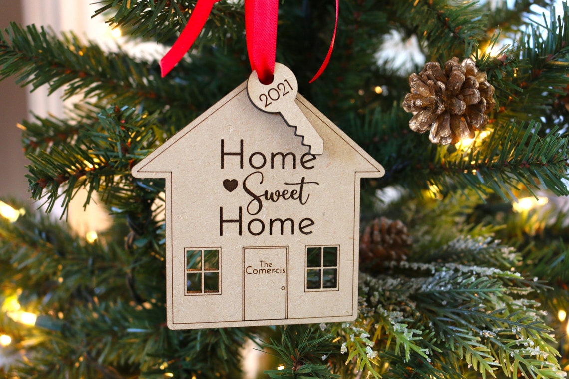 Personalized Acrylic Christmas Ornament. Made from acrylic or wood, this ornament is the perfect decoration to celebrate life’s most memorable moments. Ornaments arrive in a kraft gift box embellished with a black bow Customer design laser cut lettering with multiple ribbon options. thequinnandcompany. www.thequinnandcompany.com