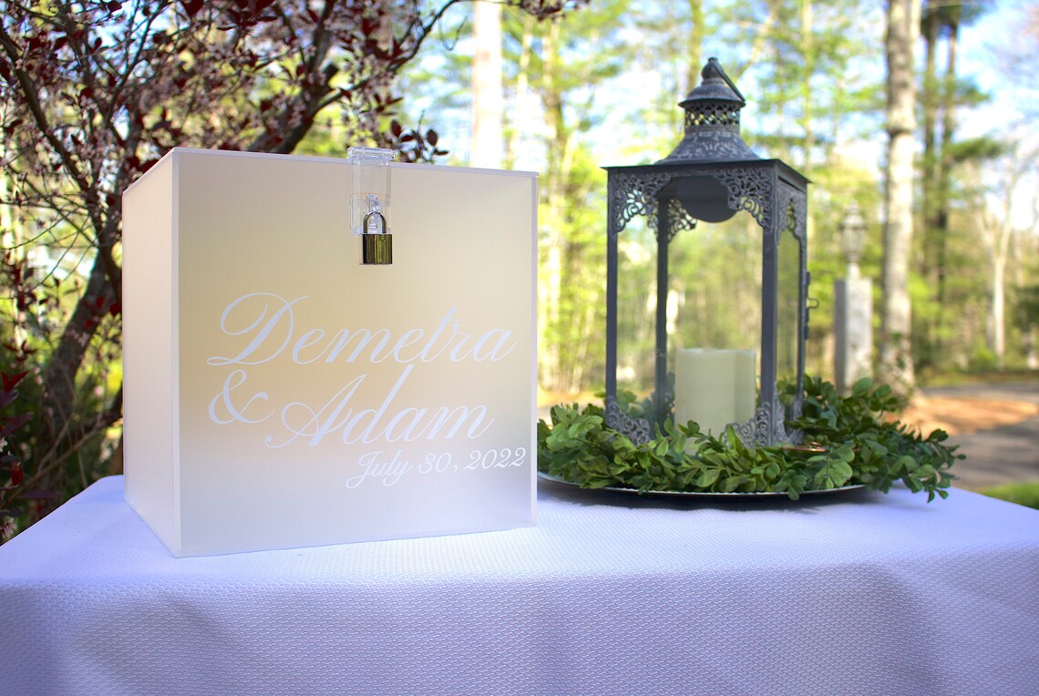 Acrylic card box with lock and key. Customizable designs and fonts made to keep celebratory cards, money or event donations safe and accessible. Place this beautiful card box anywhere your guests gather. thequinnandcompany www.thequinnandcompany.com