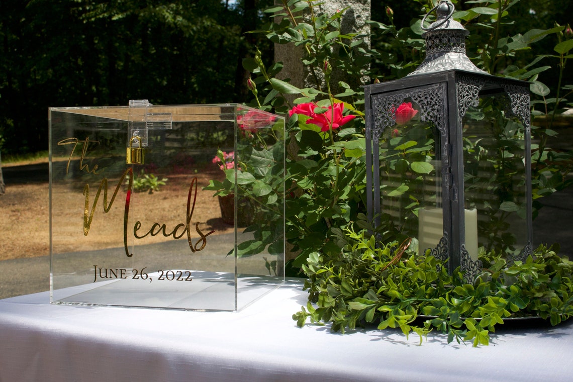 Acrylic card box with lock and key. Customizable designs and fonts made to keep celebratory cards, money or event donations safe and accessible. Place this beautiful card box anywhere your guests gather. thequinnandcompany www.thequinnandcompany.com