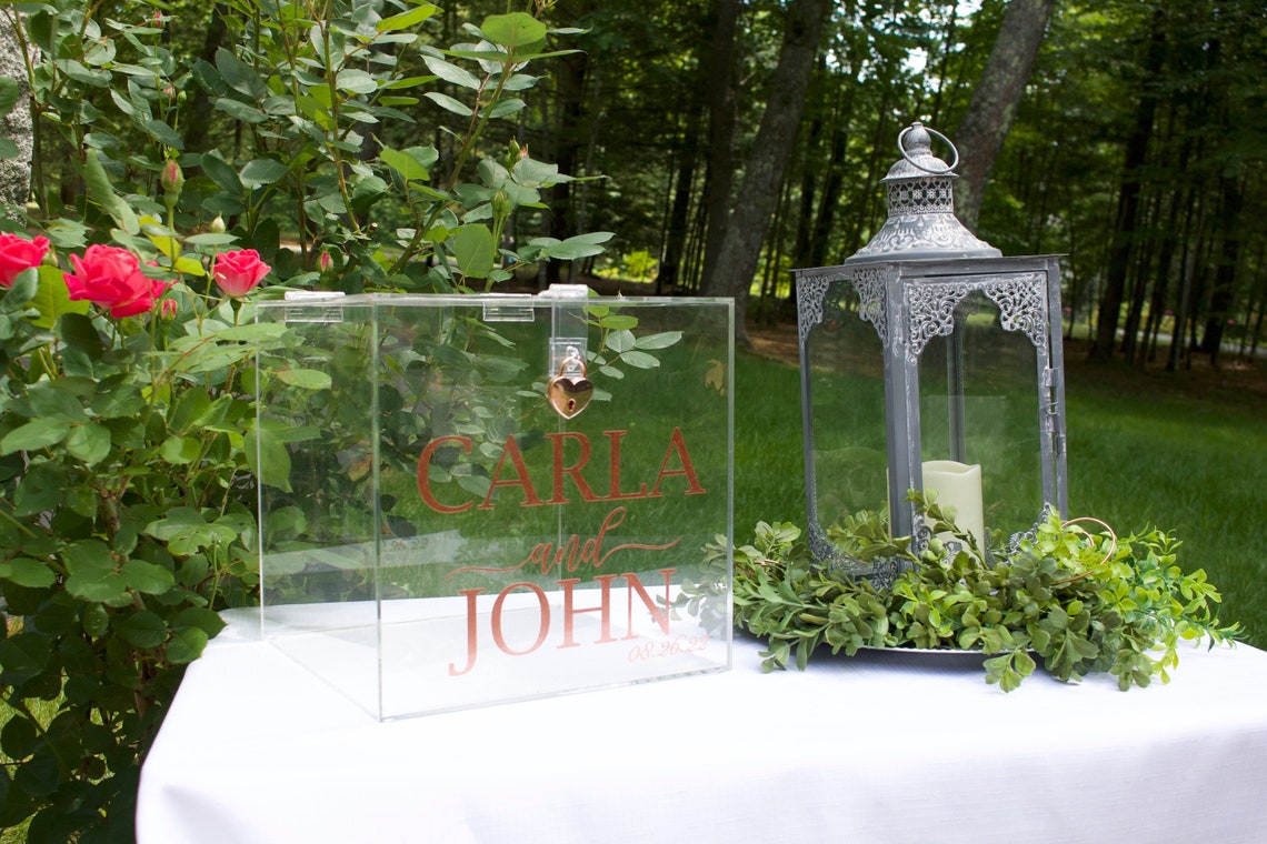 Acrylic card box with lock and key. Customizable designs and fonts made to keep celebratory cards, money or event donations safe and accessible. Place this beautiful card box anywhere your guests gather. thequinnandcompany www.thequinnandcompany.com
