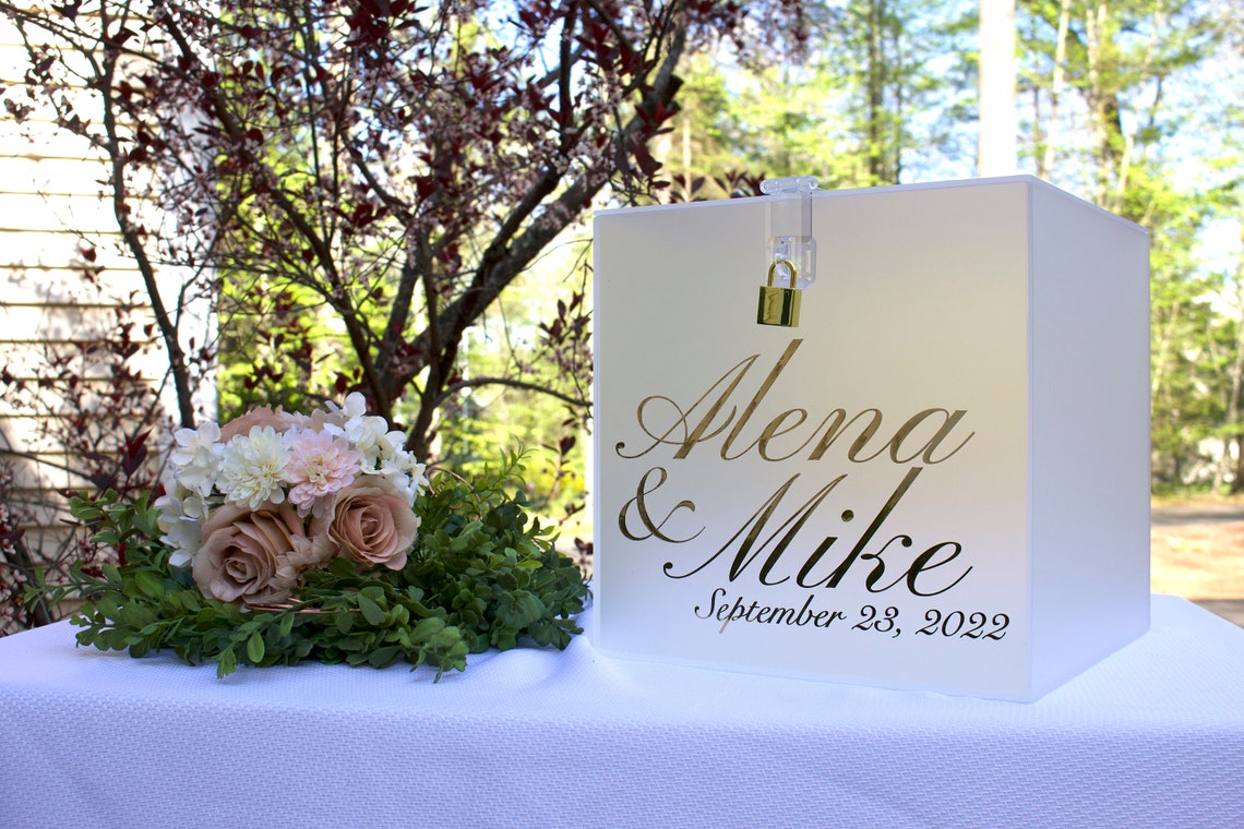 Acrylic card box with lock and key. Customizable designs and fonts made to keep celebratory cards, money or event donations safe and accessible. Place this beautiful card box anywhere your guests gather. thequinnandcompany www.thequinnandcompany.com