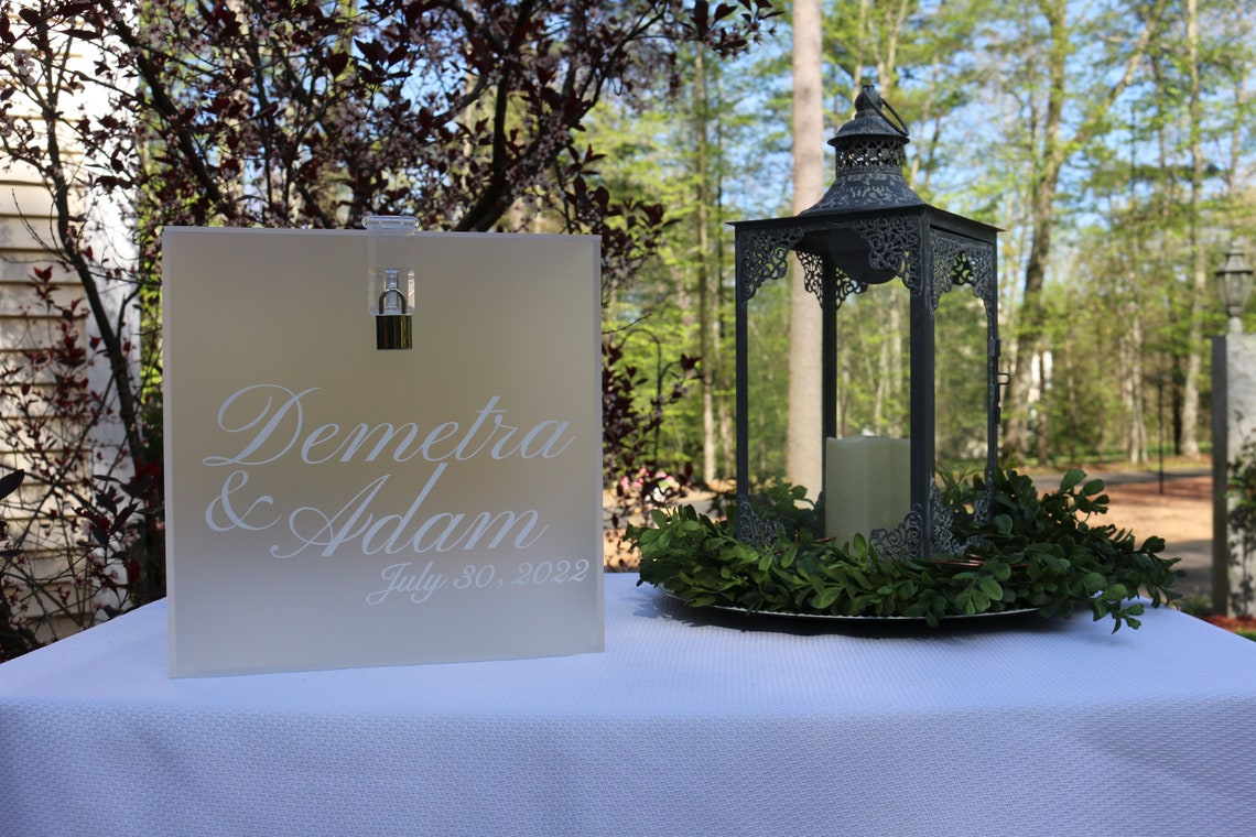 Acrylic card box with lock and key. Customizable designs and fonts made to keep celebratory cards, money or event donations safe and accessible. Place this beautiful card box anywhere your guests gather. thequinnandcompany www.thequinnandcompany.com