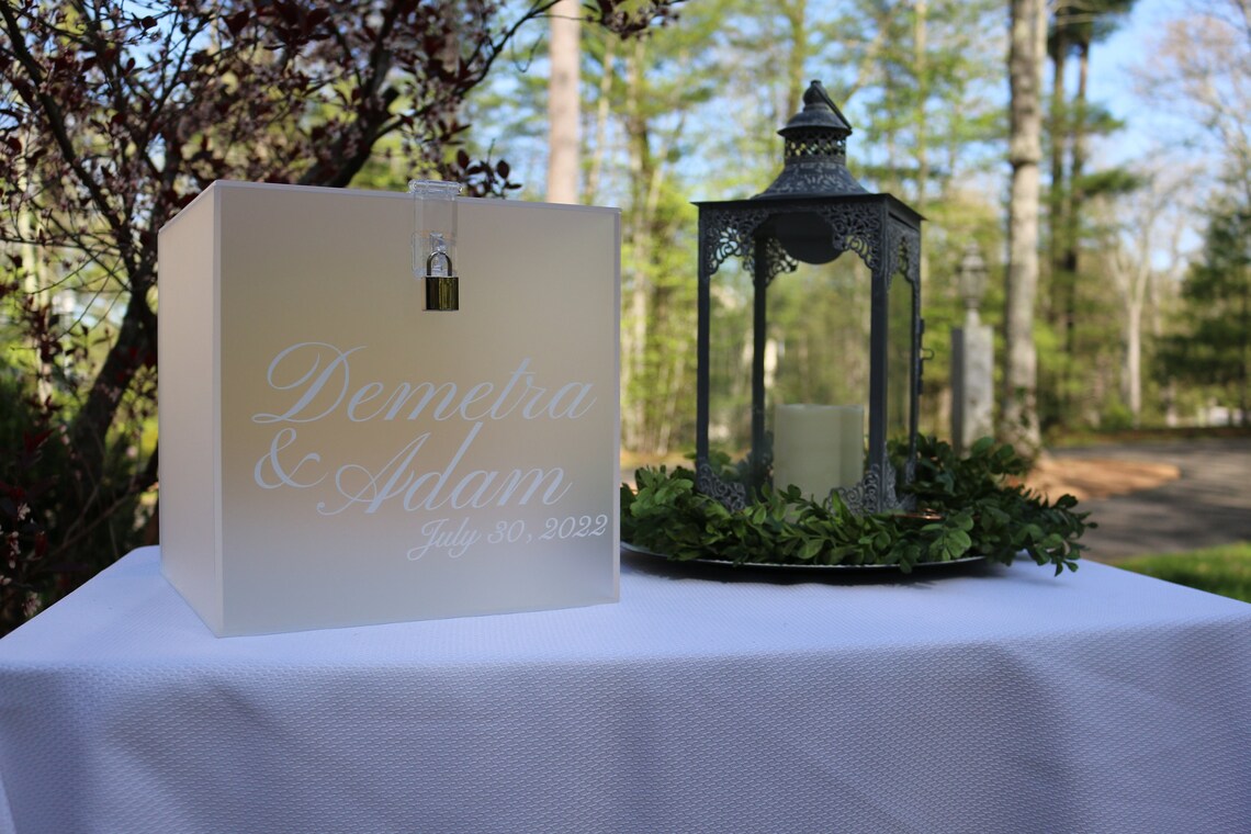 Acrylic card box with lock and key. Customizable designs and fonts made to keep celebratory cards, money or event donations safe and accessible. Place this beautiful card box anywhere your guests gather. thequinnandcompany www.thequinnandcompany.com