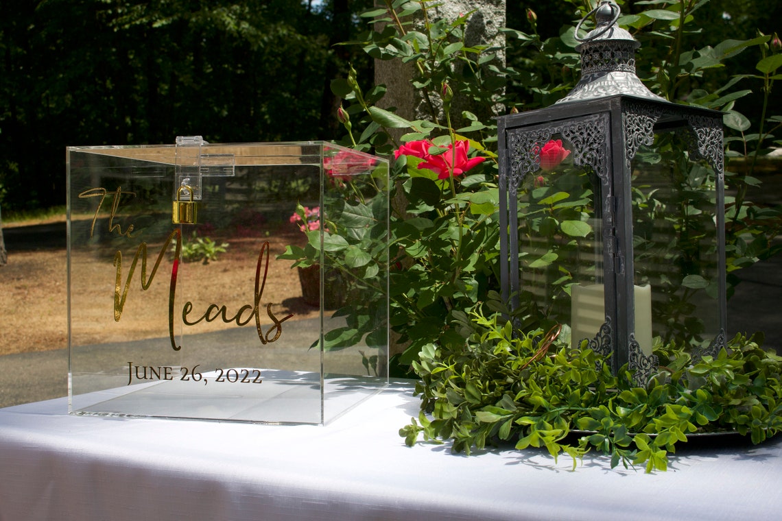 Acrylic card box with lock and key. Customizable designs and fonts made to keep celebratory cards, money or event donations safe and accessible. Place this beautiful card box anywhere your guests gather. thequinnandcompany www.thequinnandcompany.com
