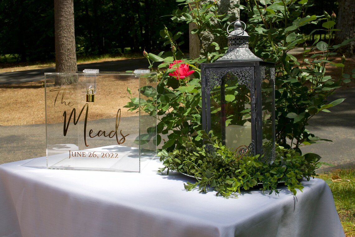 Acrylic card box with lock and key. Customizable designs and fonts made to keep celebratory cards, money or event donations safe and accessible. Place this beautiful card box anywhere your guests gather. thequinnandcompany www.thequinnandcompany.com