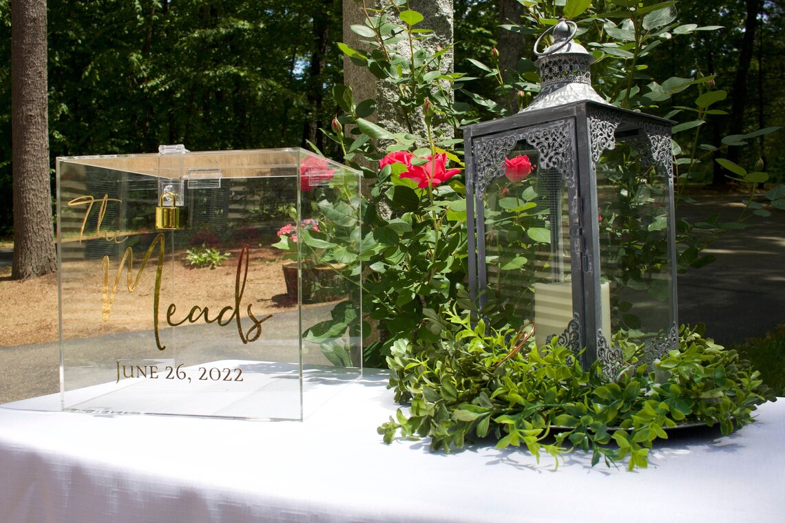 Acrylic card box with lock and key. Customizable designs and fonts made to keep celebratory cards, money or event donations safe and accessible. Place this beautiful card box anywhere your guests gather. thequinnandcompany www.thequinnandcompany.com