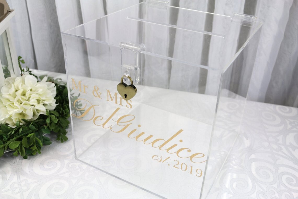 Acrylic card box with lock and key. Customizable designs and fonts made to keep celebratory cards, money or event donations safe and accessible. Place this beautiful card box anywhere your guests gather. thequinnandcompany www.thequinnandcompany.com