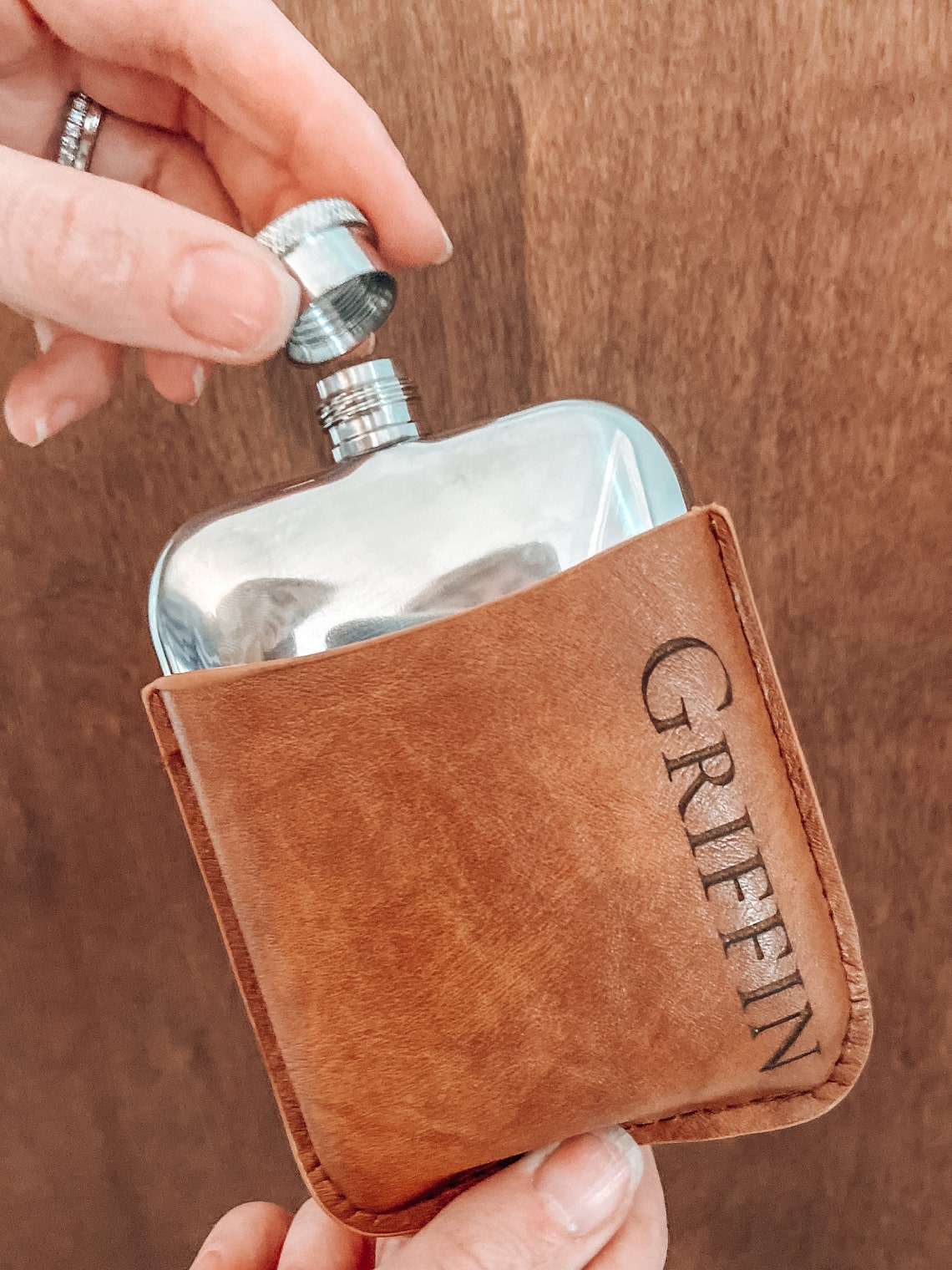 Flask set. A lovely gift for birthdays, Father's Day, or for the groomsmen at your wedding. Fill the flask with their favorite drink for a thoughtful surprise. Each personalized men's flask is custom laser engraved to your specifications and is made of stainless steel.