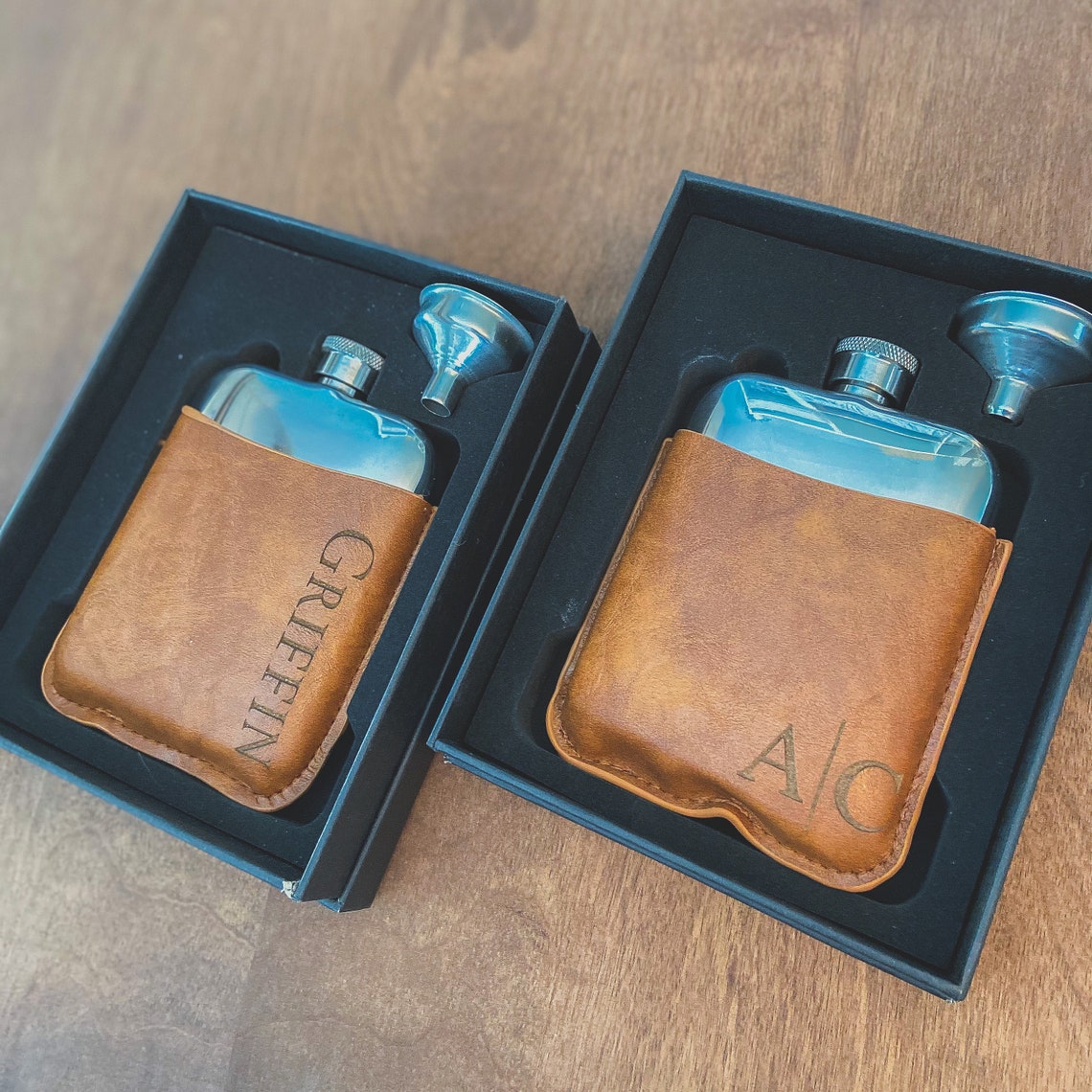 Flask set. A lovely gift for birthdays, Father's Day, or for the groomsmen at your wedding. Fill the flask with their favorite drink for a thoughtful surprise. Each personalized men's flask is custom laser engraved to your specifications and is made of stainless steel.