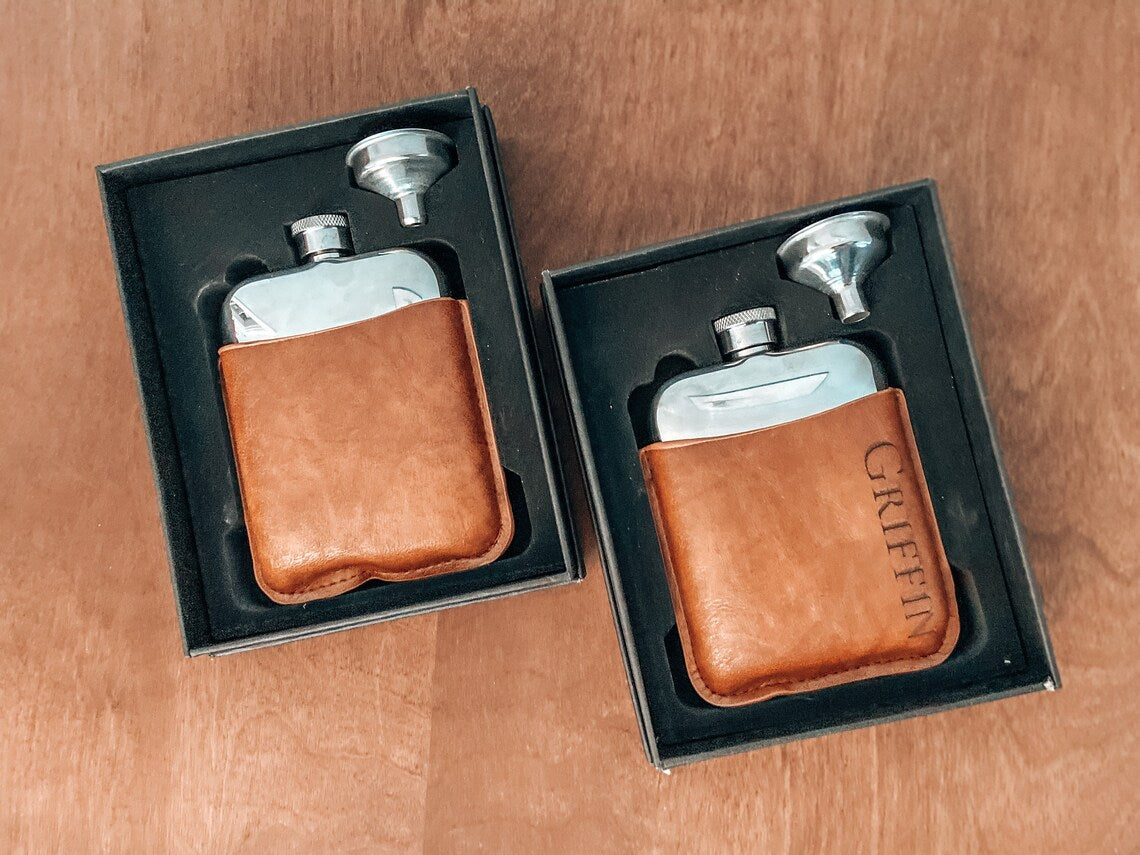 Flask set. A lovely gift for birthdays, Father's Day, or for the groomsmen at your wedding. Fill the flask with their favorite drink for a thoughtful surprise. Each personalized men's flask is custom laser engraved to your specifications and is made of stainless steel.