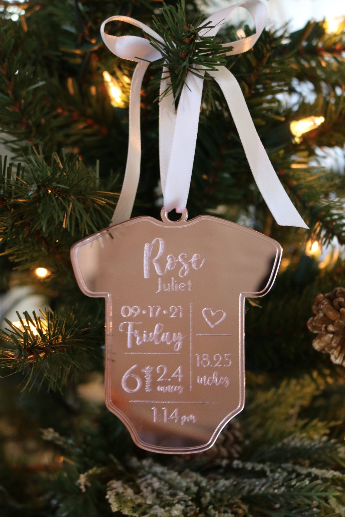 Personalized Baby Christmas Ornament. Made from acrylic, this ornament is the perfect decoration to celebrate the precious addition to your family. Laser cut lettering with multiple ribbon options. thequinnandcompany. www.thequinnandcompany.com